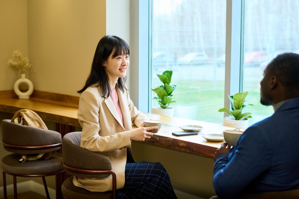 Woman meeting with colleague at cafe